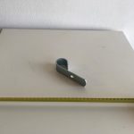 Gancio per doppia apertura